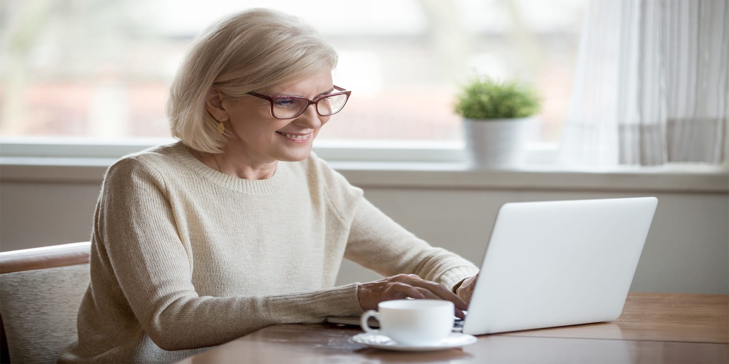 Female real estate investor working on computer